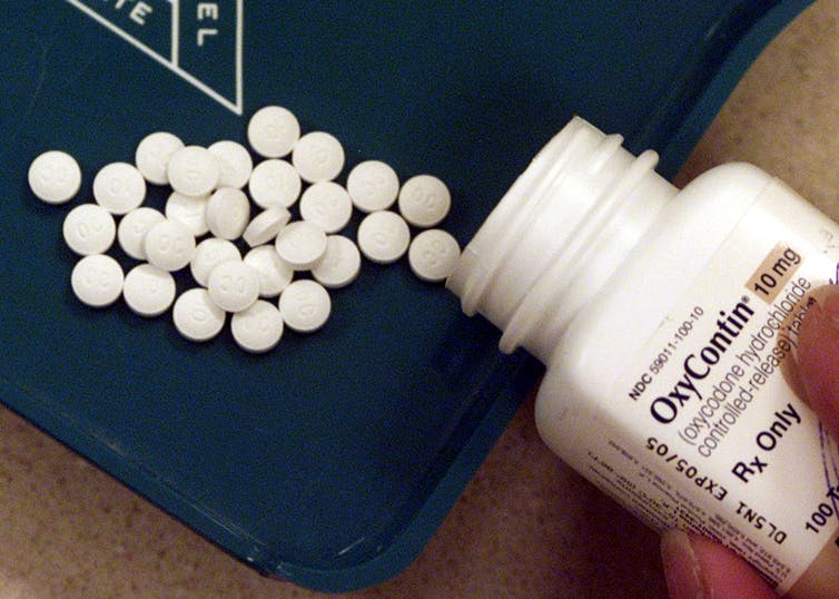 Pill bottle and pills of OxyContin prescription-only pain medication