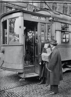 men with a streetcar