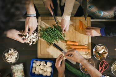 Vegetables being cut in cooking class