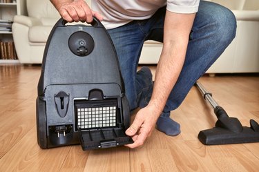 replacing an air filter in vacuum cleaner