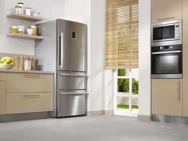 Kitchen with stainless steel refrigerator