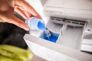 Adding detergent to washer