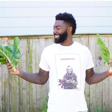 Timothy posing with vegetables