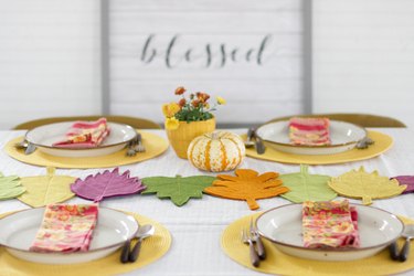 This colorful DIY felt fall leaves table runner is easy to make, will brighten up your fall table and make all your meals feel special.