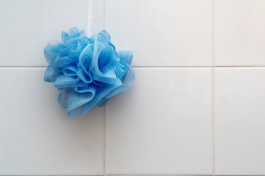 Close-Up Of Loofah Hanging On Wall At Home