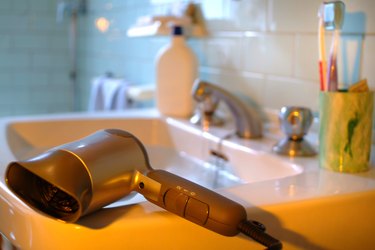 Close-Up Of Hair Dryer On Sink