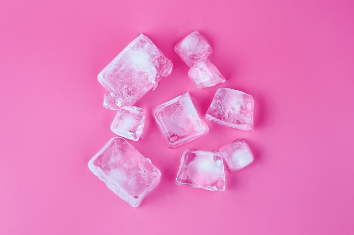 Directly Above Shot Of Ice Cubes Over Pink Background