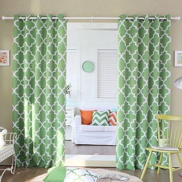 green patterned drapery panels