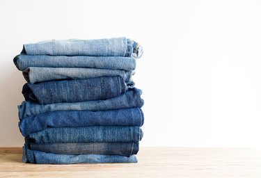 stack of blue jeans.