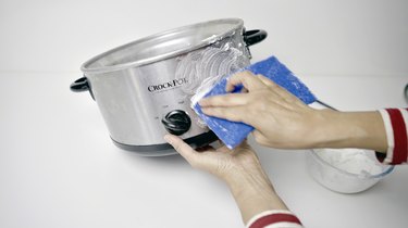 Using DIY gentle cleansing paste for slow cooker on outer pot.