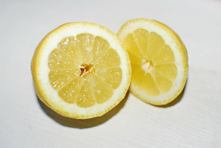 Close-Up Of Lemon Slice On Table