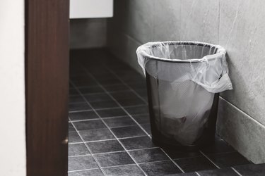 Dustbin On Tiled Floor