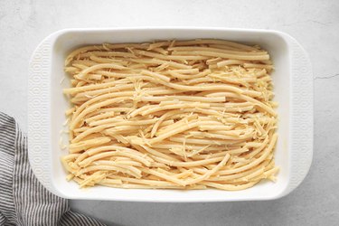 Arrange noodles in a large casserole dish