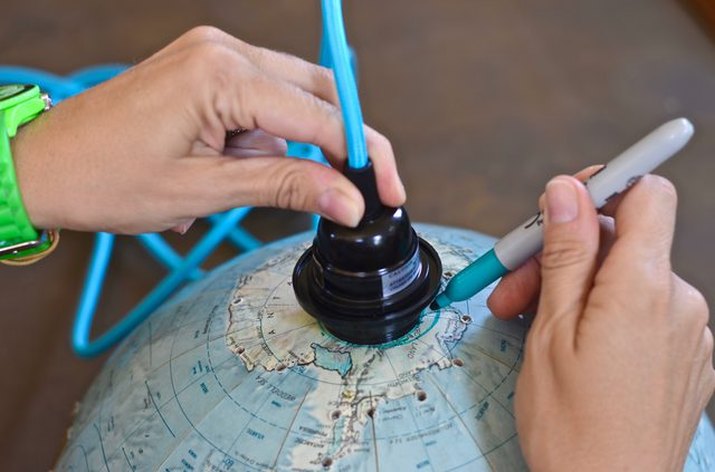 A classroom globe transformed into a pendent light