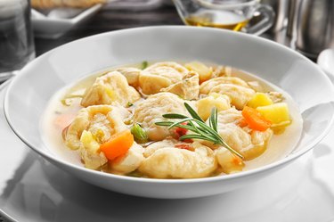 White plate of delicious chicken and dumplings closeup