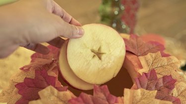 Adding sliced apples to Pumpkin Pie Punch