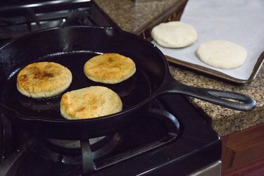 Papusas cooking in a skillet
