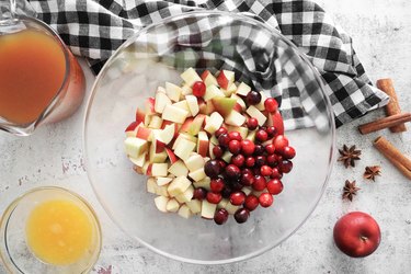 Combine apples and cranberries