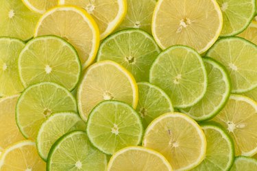 Slices of yellow lemons and green limes