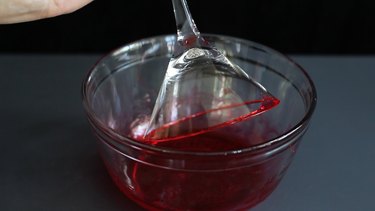 Dipping rim in red syrup