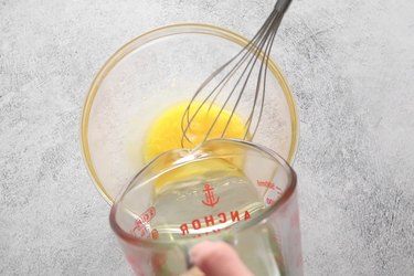 Slowly add oil and keep whisking