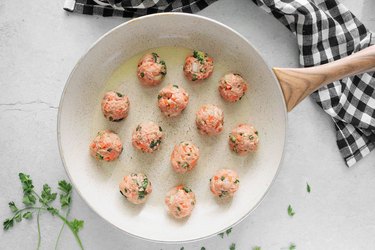 Brown meatballs in a large skillet