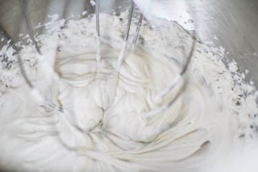 Mixer with whisk, making whipped cream