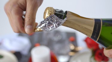 Remove foil from champagne bottle.