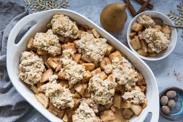 Casserole dish and bowl of pear cobbler