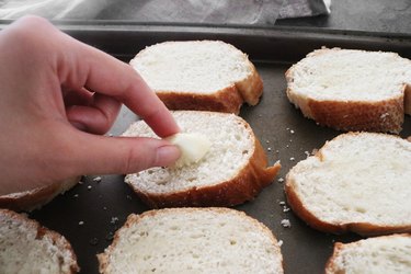 Rub the bread with garlic