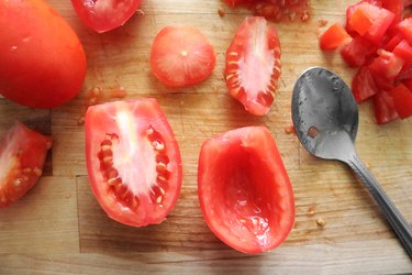 Remove seeds and pulp from tomatoes