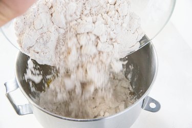 Pouring flour into mixer