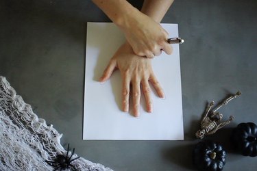 Tracing hand on paper