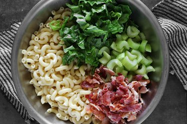 Add macaroni, lettuce, celery and bacon in a bowl