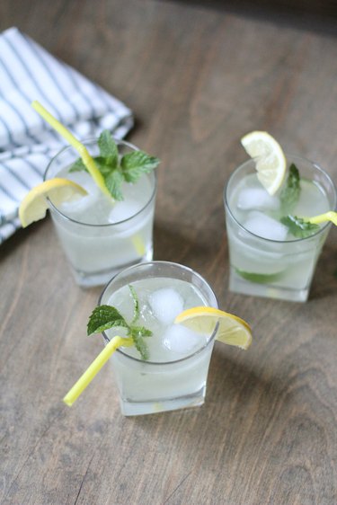 Three glasses of sparkling lemonade with mint garnish