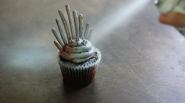 Spraying cupcake silver