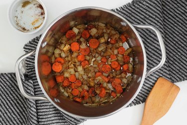 Cook onion, carrots and garlic with spices