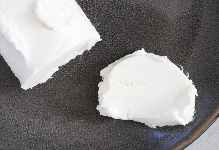 Slice a piece of goat cheese
