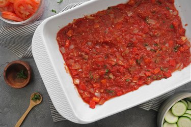 Layer the tomato sauce into a dish