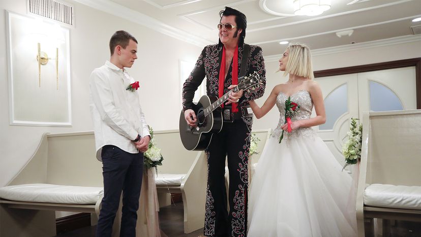 An Elvis impersonator sings for a couple at a wedding chapel in Las Vegas, Nevada. 