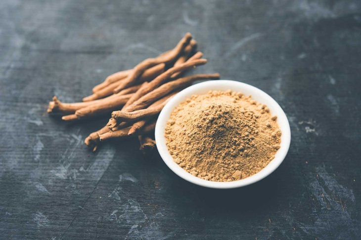 Ashwagandha / Aswaganda OR Indian Ginseng is an Ayurveda medicine in stem and powder form. Isolated on plain background. selective focus