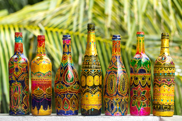 9 Bottle Painting Projects for Beginners | If you're looking for simple, easy, and beautiful bottle painting ideas, grab your empty wine, beer, and water bottles plus your acrylics and give these DIY designs a try! We've included tips and techniques for beginners to help you get started, with bottle painting designs for both glass and plastic bottles. These make beautiful homemade gifts, and many of these are suitable for kids to do!