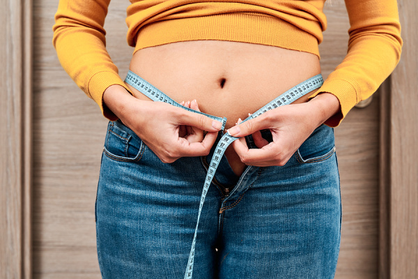 How To Get Rid of Menopause Belly Fat | From hot flashes, to night sweats, to mood swings, perimenopause and menopause can cause many uncomfortable symptoms. Many women gain weight during the transition to menopause, particularly around their midsection, which can lead to metabolic syndrome and other health-related conditions. The good news is that it IS possible to lose weight after menopause, and this post includes lifestyle changes plus diet and exercise tips to help!